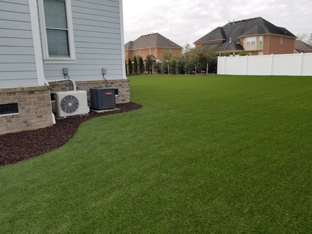 Artificial grass in a residential backyard