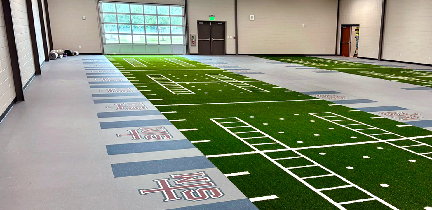 Indoor agility track with markings on the artificial turf