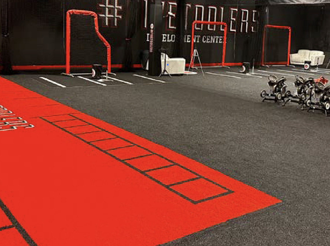 Red prefabricated turf installed in gym