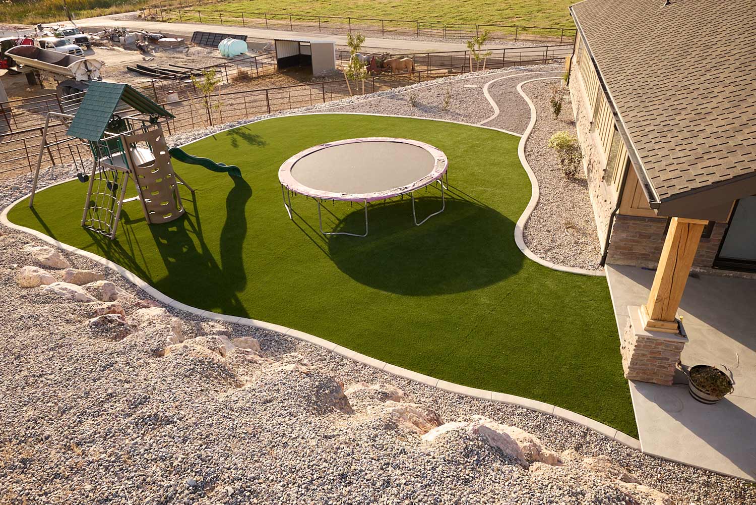 playground in a backyard with artificial grass